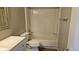 Bright bathroom with shower-tub combo, toilet, and a modern vanity at 5956 S Winnipeg St, Aurora, CO 80015