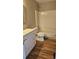 Well-lit bathroom featuring a shower-tub combo and white vanity at 5956 S Winnipeg St, Aurora, CO 80015