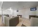 Spacious basement area with comfortable seating, wood accents, and natural light at 8690 E Chenango Ave, Denver, CO 80237