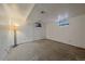 Unfinished basement with painted walls, concrete floors and windows providing natural light at 8690 E Chenango Ave, Denver, CO 80237