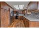 Modern kitchen featuring stainless steel appliances, custom cabinetry, and decorative backsplash at 8690 E Chenango Ave, Denver, CO 80237