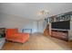 Spacious living room with tile floors and staircase to the second level at 8690 E Chenango Ave, Denver, CO 80237