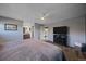 Spacious main bedroom with ensuite bathroom and adjoined laundry room at 8690 E Chenango Ave, Denver, CO 80237
