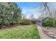Green backyard with a detached shed and mature trees at 1920 S Downing St, Denver, CO 80210