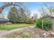 Landscaped backyard featuring a healthy lawn and mature trees at 1920 S Downing St, Denver, CO 80210