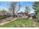 Spacious backyard featuring a detached shed with a seating area at 1920 S Downing St, Denver, CO 80210