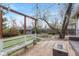 Wooden deck with seating, string lights, and view of backyard with shed at 1920 S Downing St, Denver, CO 80210