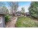 Lush backyard featuring a detached shed at 1920 S Downing St, Denver, CO 80210