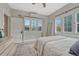 Bright bedroom featuring large windows, neutral decor, a ceiling fan, and a patterned rug at 1920 S Downing St, Denver, CO 80210