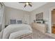 This cozy, spacious bedroom features natural light, a ceiling fan, and space for decor, furniture, and comfort at 1920 S Downing St, Denver, CO 80210