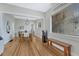 Bright dining room boasts wood floors, modern light fixture, and entryways that provide an inviting flow throughout the house at 1920 S Downing St, Denver, CO 80210