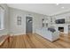 Bright living room featuring hardwood floors, natural light and a stylish sofa at 1920 S Downing St, Denver, CO 80210
