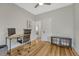 This open office features lots of natural light, wood floors, and plenty of space for decor and storage solutions at 1920 S Downing St, Denver, CO 80210