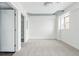 Bright bedroom features carpeted floors, a window, and exposed ductwork at 2835 W Parkside Pl # 305, Denver, CO 80221