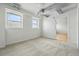 Bright bedroom features two windows and a doorway to a closet or bathroom at 2835 W Parkside Pl # 305, Denver, CO 80221