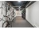 Practical bike storage room with multiple racks and ample space for storing bicycles, perfect for cycling enthusiasts at 2835 W Parkside Pl # 305, Denver, CO 80221