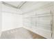 Walk-in closet is well equipped with adjustable shelving and ample storage space at 2835 W Parkside Pl # 305, Denver, CO 80221