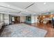 Spacious common area featuring versatile spaces for various activities, with a large rug adding style and warmth at 2835 W Parkside Pl # 305, Denver, CO 80221