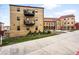 Well-maintained apartment building featuring balconies, landscaping, and easy access to walking paths at 2835 W Parkside Pl # 305, Denver, CO 80221