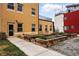 Apartment building featuring curated planters with mature landscaping in a well-maintained yard at 2835 W Parkside Pl # 305, Denver, CO 80221