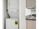 The laundry area features a stacked washer and dryer, and cabinet with sink at 2835 W Parkside Pl # 305, Denver, CO 80221