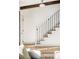 Elegant staircase with a modern metal railing at 7310 S Eudora Way, Centennial, CO 80122