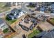 Foundation being built in residential area with surrounding homes and street view at 933 Saint Andrews Ln, Louisville, CO 80027