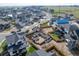 New community aerial view showcases homes, construction, and open space, offering a blend of modern living and natural beauty at 933 Saint Andrews Ln, Louisville, CO 80027