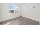 Bright bedroom with large windows, neutral paint, and modern flooring at 933 Saint Andrews Ln, Louisville, CO 80027