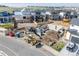 Aerial view of construction site with a foundation, machinery, and building materials, highlighting progress on new home at 933 Saint Andrews Ln, Louisville, CO 80027