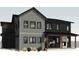 Rear exterior view featuring light gray siding and a covered back porch at 933 Saint Andrews Ln, Louisville, CO 80027