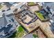 Aerial view of a new home construction site with the foundation poured and the initial stages of building underway at 933 Saint Andrews Ln, Louisville, CO 80027