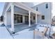 Covered patio with seating area, extending from the house into the backyard at 4911 Colorado River Dr, Firestone, CO 80504