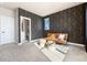 Bedroom with en-suite bathroom and sitting area at 4911 Colorado River Dr, Firestone, CO 80504
