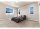 Simple bedroom with double bed and large windows at 4911 Colorado River Dr, Firestone, CO 80504