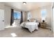 Spacious bedroom with large window and wood accent wall at 4911 Colorado River Dr, Firestone, CO 80504