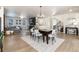 Bright dining area with hardwood floors and a view into the living room at 4911 Colorado River Dr, Firestone, CO 80504
