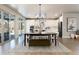 Open concept dining room with table and chairs, hardwood floors, and access to kitchen at 4911 Colorado River Dr, Firestone, CO 80504