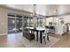 Modern dining area with large sliding doors leading to the backyard at 4911 Colorado River Dr, Firestone, CO 80504
