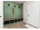Stylish entryway with built-in bench and cubbies at 4911 Colorado River Dr, Firestone, CO 80504
