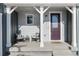 Charming front porch with two chairs and a welcoming doormat at 4911 Colorado River Dr, Firestone, CO 80504