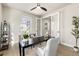 Bright home office features built-in shelving and hardwood floors at 4911 Colorado River Dr, Firestone, CO 80504