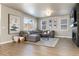 Open concept living room featuring a modern fireplace and large sectional sofa at 4911 Colorado River Dr, Firestone, CO 80504