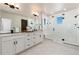 Elegant main bathroom with double vanity and large shower at 4911 Colorado River Dr, Firestone, CO 80504