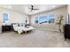 Large main bedroom with plush carpet and ample natural light at 4911 Colorado River Dr, Firestone, CO 80504