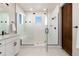 Spacious main shower with built-in seat and frameless glass at 4911 Colorado River Dr, Firestone, CO 80504