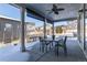 Covered patio with outdoor dining set at 4911 Colorado River Dr, Firestone, CO 80504