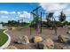 Community playground with slides, climbing structures, and swings at 4911 Colorado River Dr, Firestone, CO 80504