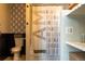 Bathroom showcasing modern geometric wallpaper and shower curtain with positive affirmations at 19044 E 16Th Ave, Aurora, CO 80011