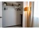 Organized closet space with shelving, hanging rods, and a soft light from the nearby window at 19044 E 16Th Ave, Aurora, CO 80011